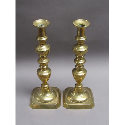 53 - A pair of Victorian brass Jubilee candlesticks, triple knopped on square bases, 38.5cm h.