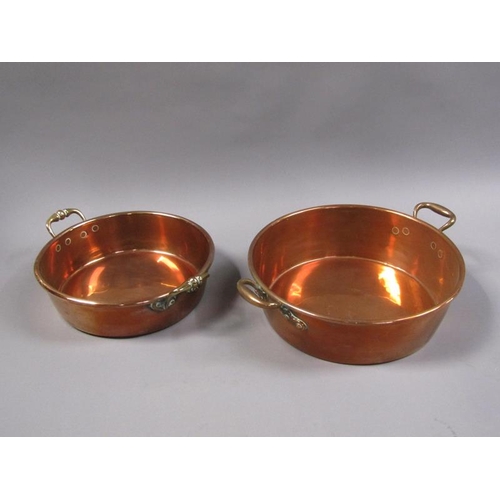 55 - Two 19c copper and brass two handled pans, 40cm & 35cm diam, 7cm & 13cm deep.