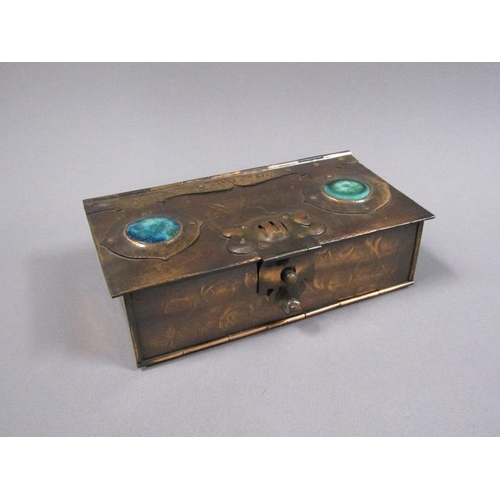 58 - An Arts & Craft copper anodised playing card box of rectangular form with fall front and rising cove... 
