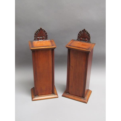 61 - A pair of 19c mahogany table top boxes with rising front panels with shell and scroll carved pedimen... 