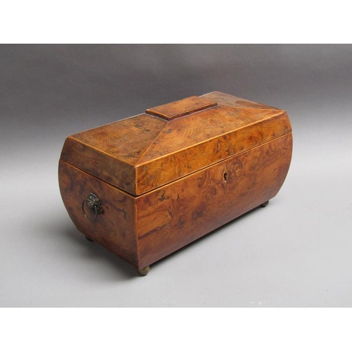 62 - A late Georgian burr walnut veneered caddy box of bombe form with lion mask ring pull side handles a... 