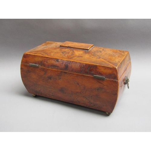 62 - A late Georgian burr walnut veneered caddy box of bombe form with lion mask ring pull side handles a... 
