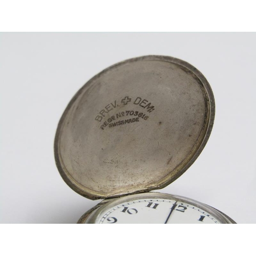 74 - An early 20c Swiss full hunter pocket watch, the base metal case having convex front and back in the... 