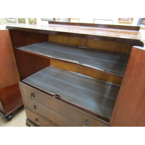 1965 - 1930'S WALNUT VENEERED SIDE CABINET, THE UPPER SHELF SECTION ENCLOSED BY TWO DOORS OVER THREE LONG D... 