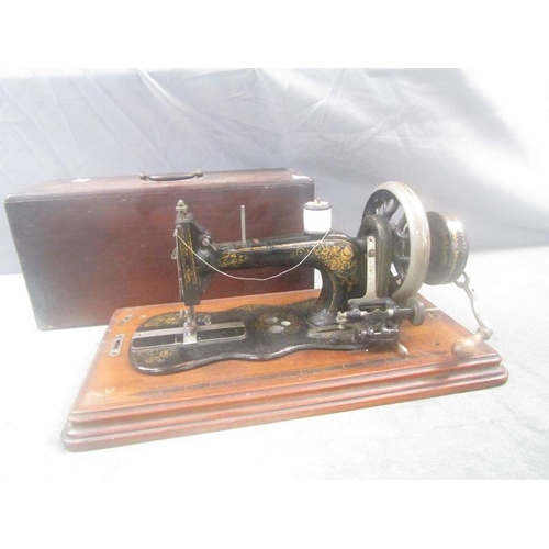 1368 - ANTIQUE SEWING MACHINE IN CASE - 53cms W