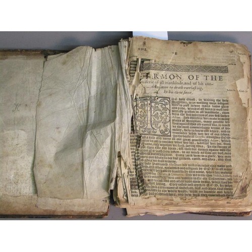 16 - A book - Book of Homileies AD 1558, -  in poor condition, spine missing, boards detached.