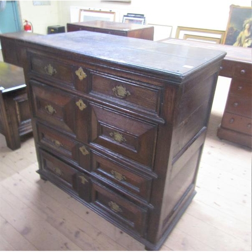 1482 - LATE 17/EARLY 18c OAK GEOMETRIC CHEST OF DRAWERS HAVING FOUR LONG DRAWERS WITH BRASS FITTINGS AND SU... 