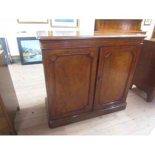 1489 - VICTORIAN FIGURED MAHOGANY SIDE CABINET WITH FITTED SHELVES ENCLOSED BY TWO PANEL DOORS ON MOULDED P... 