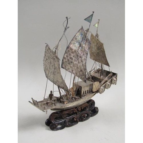 1358 - ORIENTAL SILVER MODEL OF A BOAT WITH WOODEN STAND. NAME MARKED MARY R.A.H CHOI. 18CM W