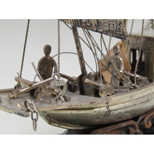 1358 - ORIENTAL SILVER MODEL OF A BOAT WITH WOODEN STAND. NAME MARKED MARY R.A.H CHOI. 18CM W