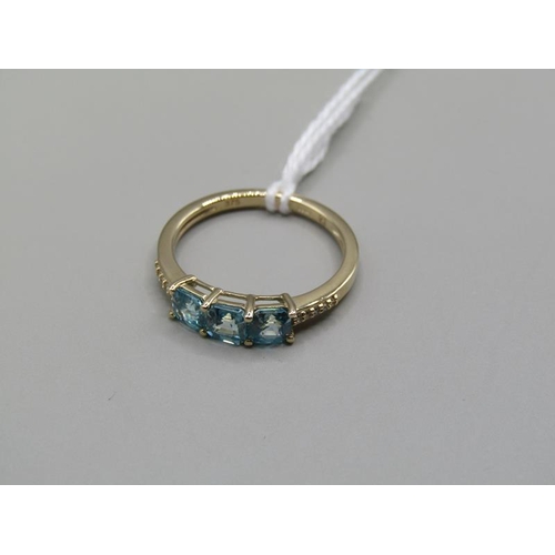 1294 - GOLD THREE STONE BLUE ZIRCON RING SIZE N 1/2