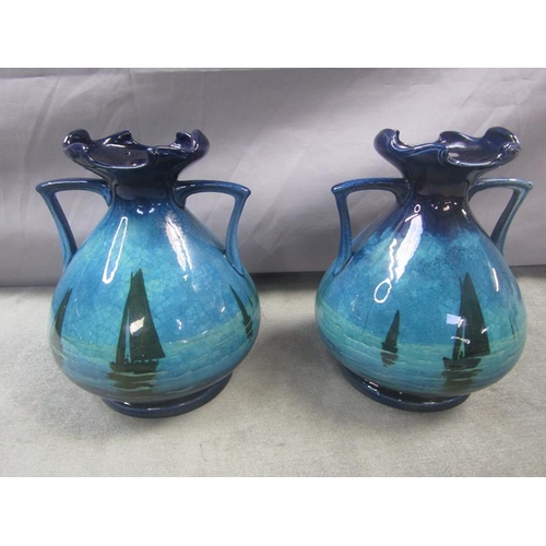 1440 - PAIR OF EARLY 20c HAND PAINTED POTTERY VASES DECORATED WITH SAILING BOATS 22 cms H