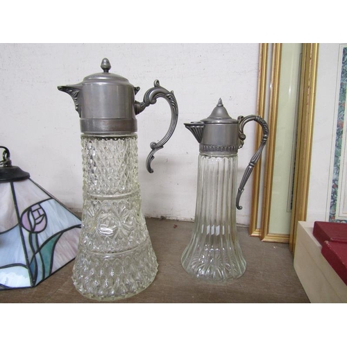 16 - TWO SILVER PLATE MOUNTED GLASS CLARET JUGS