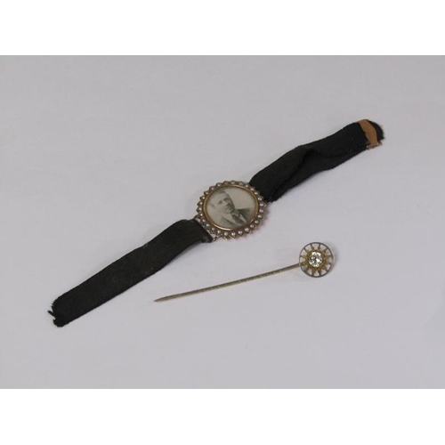 1350 - STICK PIN WITH SUNBURST TERMINAL; PEARL MOUNTED COMMEMORATIVE WRIST BROOCH