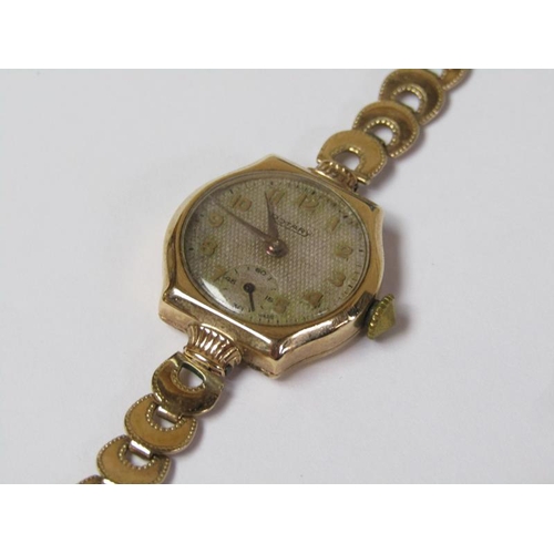 1396 - TWO 9ct GOLD LADIES WATCH MOVEMENTS, ONE WITH MATERIAL STRAP AND ONE WITH GOLD CRESCENT BRACELET