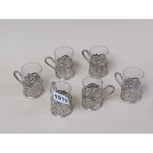 1519 - SIX SILVER TOT HOLDERS WITH CLEAR GLASS TOTS