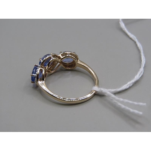 1588 - GOLD THREE STONE TANZANITE AND ZIRCON SET RING, SIZE Q