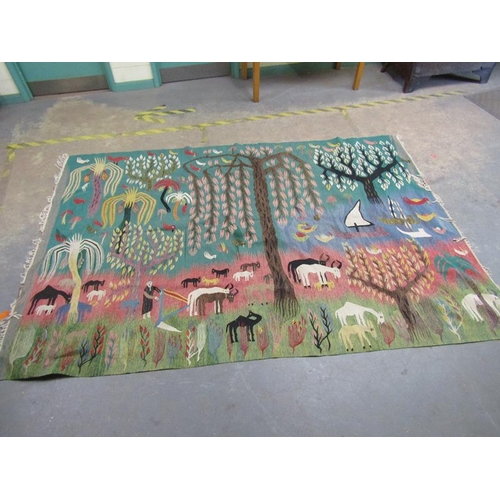 1972 - ORIENTAL WOOLLEN RUG OF GREEN GROUND DECORATED WITH FLOWERS, TREES AND ANIMALS 201 x 321 cms