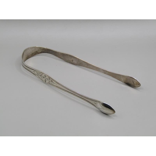 1554 - TWO BOXED SILVER NAPKINS AND A SET OF SILVER SUGAR TONGS