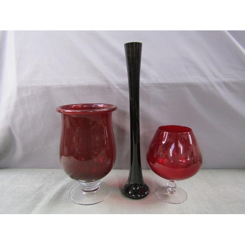 1840 - RED GLASS OVERSIZED BRANDY BALLOON AND TWO GLASS VASES, LARGEST VASE 50cms H