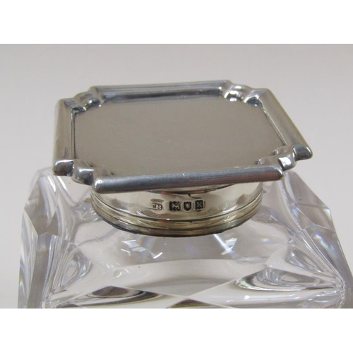 1654 - SILVER TOPPED GLASS INKWELL AND A SILVER HANDLED MAGNIFYER