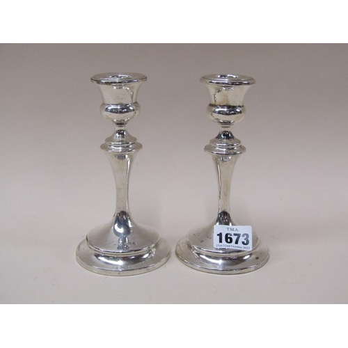 1673 - PAIR OF FILLED SILVER STICKS