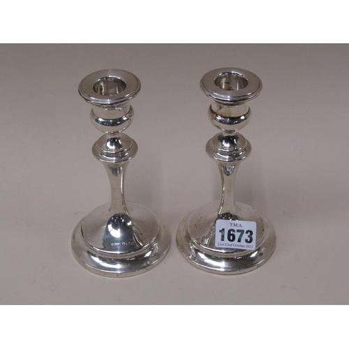 1673 - PAIR OF FILLED SILVER STICKS