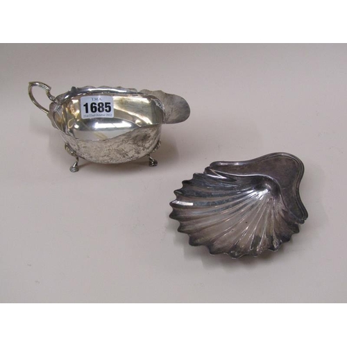 1685 - SILVER SHELL BUTTER DISH AND A SILVER SAUCEBOAT