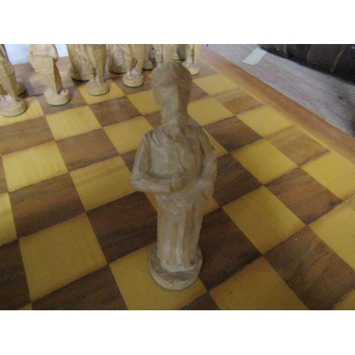 87 - CHESS SET WITH CARVED WOODEN FIGURATIVE PIECES