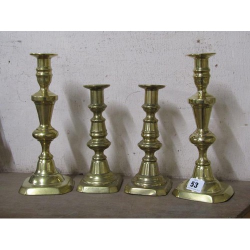 53 - TWO PAIRS OF BRASS CANDLESTICKS