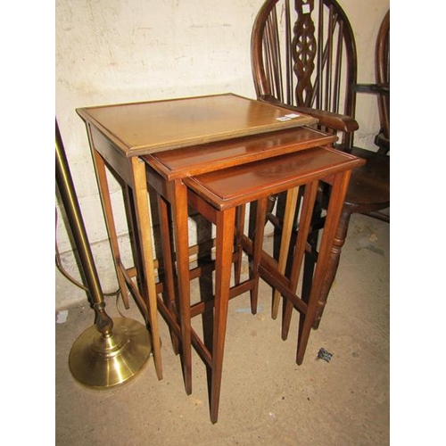 558 - NEST OF THREE MAHOGANY TABLES