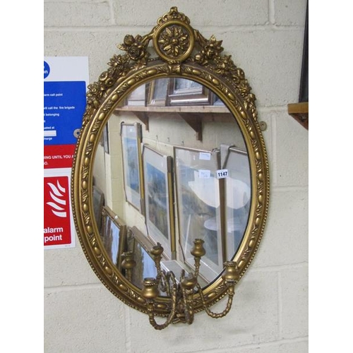 1147 - OVAL GILT FRAMED WALL MIRRORBACK WALL SCONCE, 84CM X 56CM