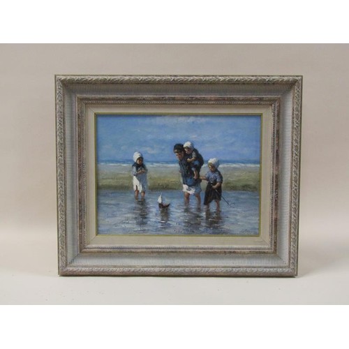 1242A - J Gaston - children with their sailing boat on the beach, signed, oil on board, framed, 29cm x 39cm.