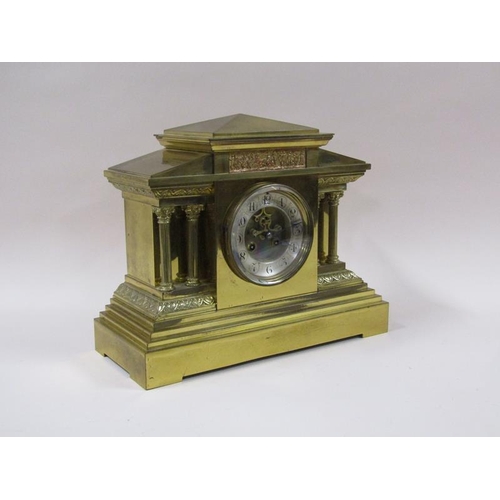 1324 - A late 19c French mantel clock in architectural polished brass case, the 12cm dial flanked by fluted... 