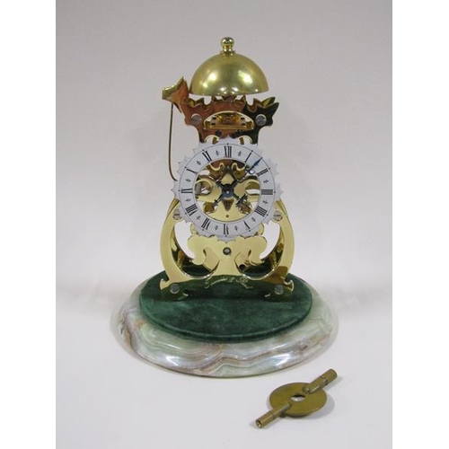 1327 - A mid 20c miniature skeleton clock by Thwaites and Reed within scroll frame plates, the single train... 