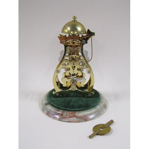 1327 - A mid 20c miniature skeleton clock by Thwaites and Reed within scroll frame plates, the single train... 