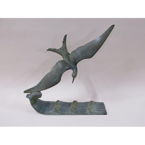 1444 - An early 20c green patinated bronze figure of a flying sea bird over water, inscribed and by G. Garr... 