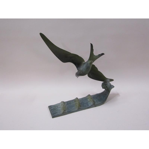 1444 - An early 20c green patinated bronze figure of a flying sea bird over water, inscribed and by G. Garr... 