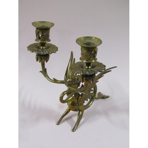 1450 - A pair of late 19c brass griffin two branch candelabrum, 22cm h, a/f.