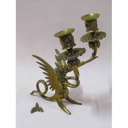 1450 - A pair of late 19c brass griffin two branch candelabrum, 22cm h, a/f.