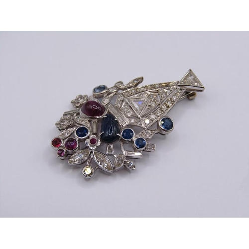 1592 - A white gold diamond, sapphire and ruby set brooch in the form of a vase of flowers, 4.23cm h.