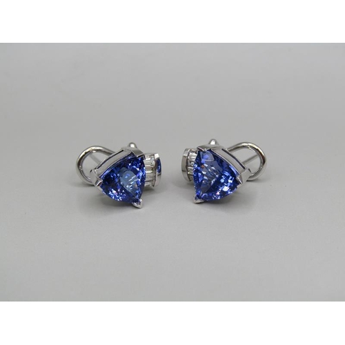 1595 - A pair of 14ct gold tanzanite and baguette diamond set earrings.