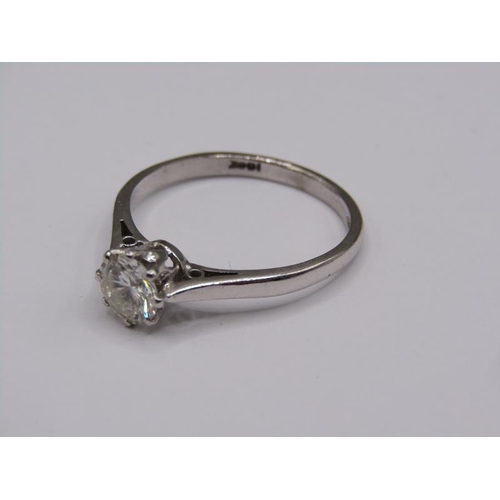 1597 - An 18ct white gold diamond solitaire ring, the diamond approx. 0.6ct, size P.