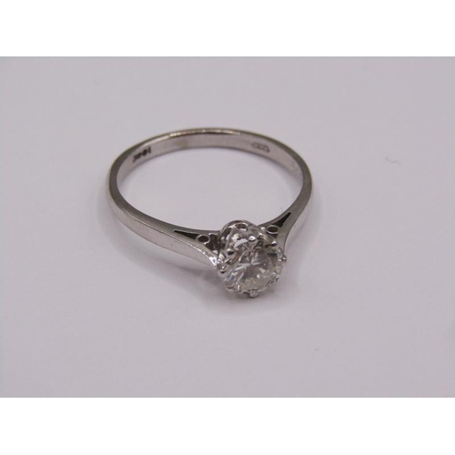 1597 - An 18ct white gold diamond solitaire ring, the diamond approx. 0.6ct, size P.