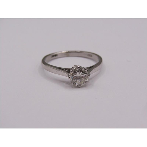 1597 - An 18ct white gold diamond solitaire ring, the diamond approx. 0.6ct, size P.