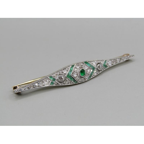 1605 - A gold diamond and emerald set bar brooch, 5.5cm w.