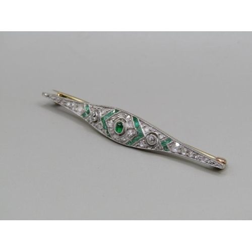 1605 - A gold diamond and emerald set bar brooch, 5.5cm w.