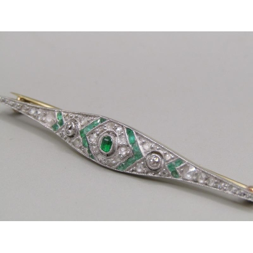 1605 - A gold diamond and emerald set bar brooch, 5.5cm w.