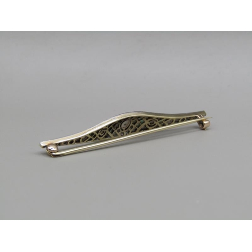 1605 - A gold diamond and emerald set bar brooch, 5.5cm w.