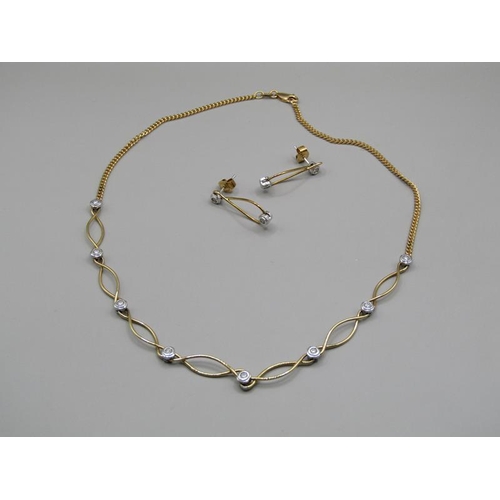 1615 - An 18ct yellow and white gold necklet, diamond set together with a pair of matching earrings.